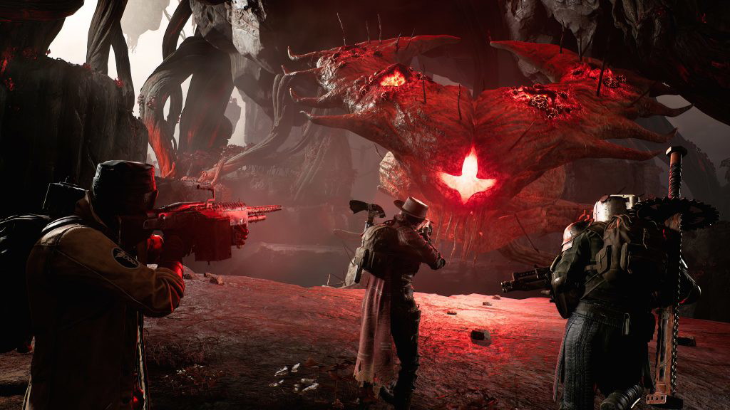 The image shows players in Remnant 2 fighting an boss. 