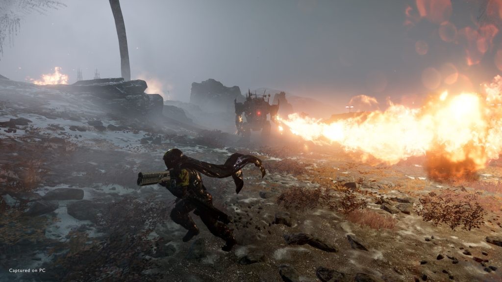 A Helldivers running away from the flamethrower attack of an Automaton in Helldivers 2.