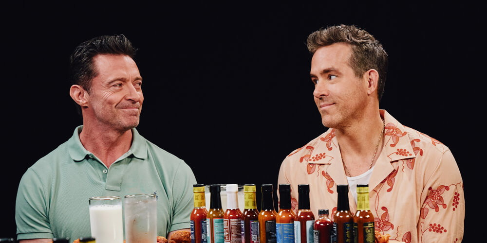 Hugh Jackman and Ryan Reynolds initially in the Hot Ones challenge. | Credit: First We Feast/YouTube.