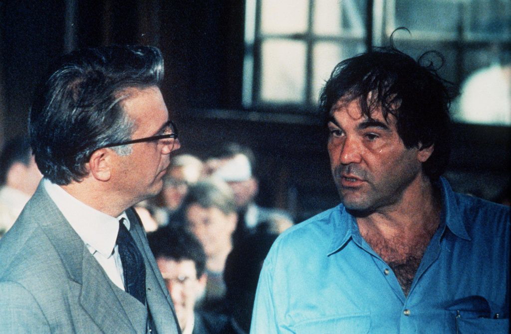 Kevin Costner and Oliver Stone on the sets of JFK | Warner Bros.