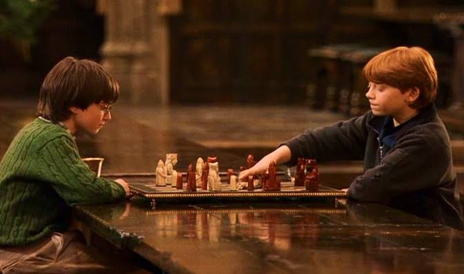 Harry and Ron playing chess | Warner Bros 