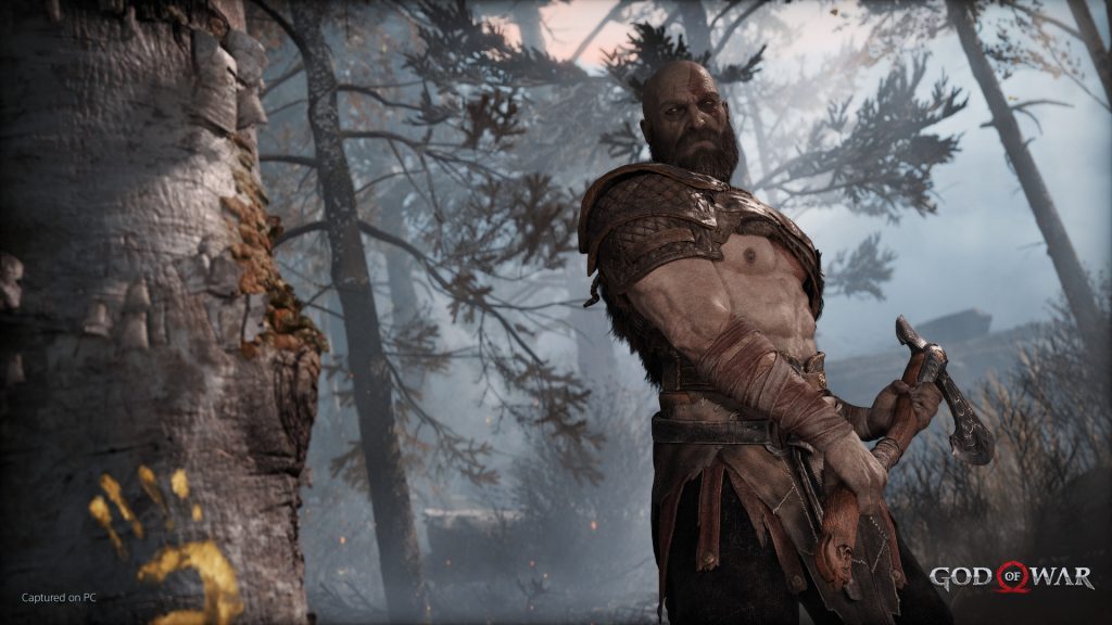 Kratos holding the Leviathan Axe in God of War