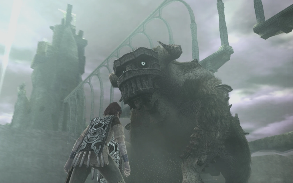 Wander standing in front of the second colossus in Shadow of the Colossus. 