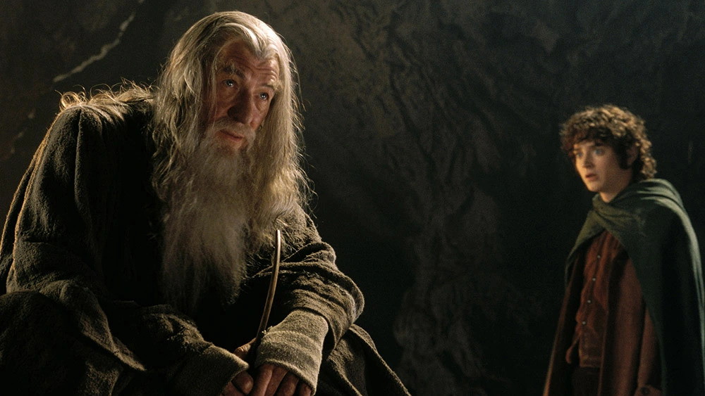 Sir Ian McKellen as Gandalf and Elijah Wood as Frodo in Lord of the Rings [Credit: New Line Cinema]