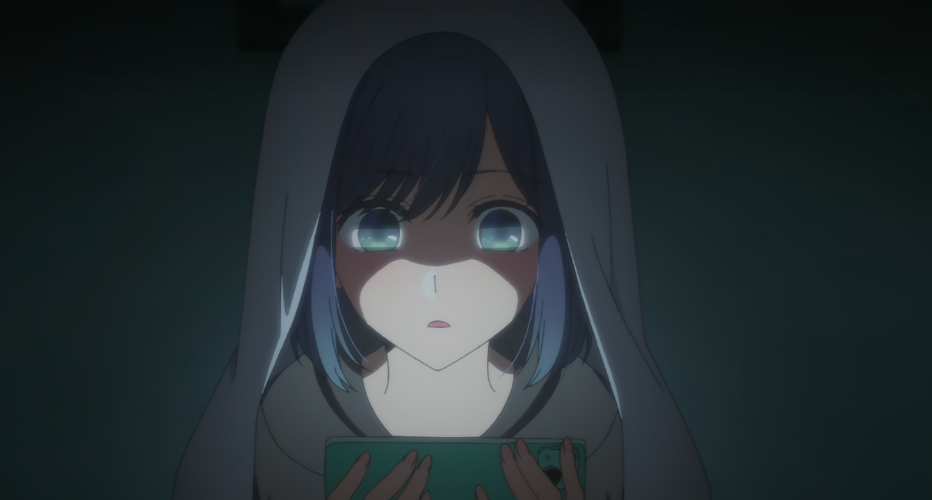 Akane's face glows in the picture because of her phone screen in Oshi No Ko 