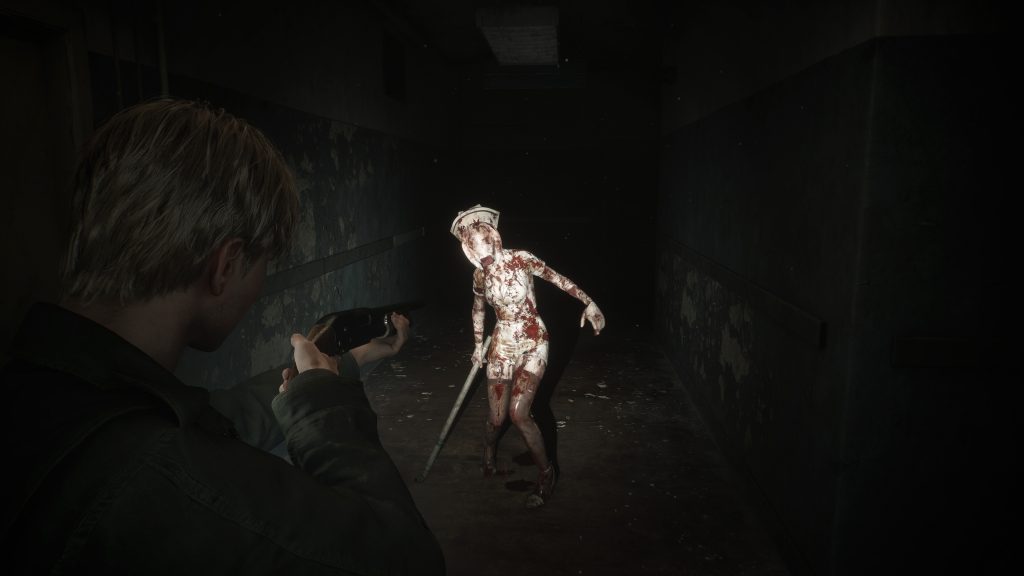 James from the Silent Hill 2 remake aims a gun at a shuffling, faceless nurse who approaches him with a metal bar in her hand.