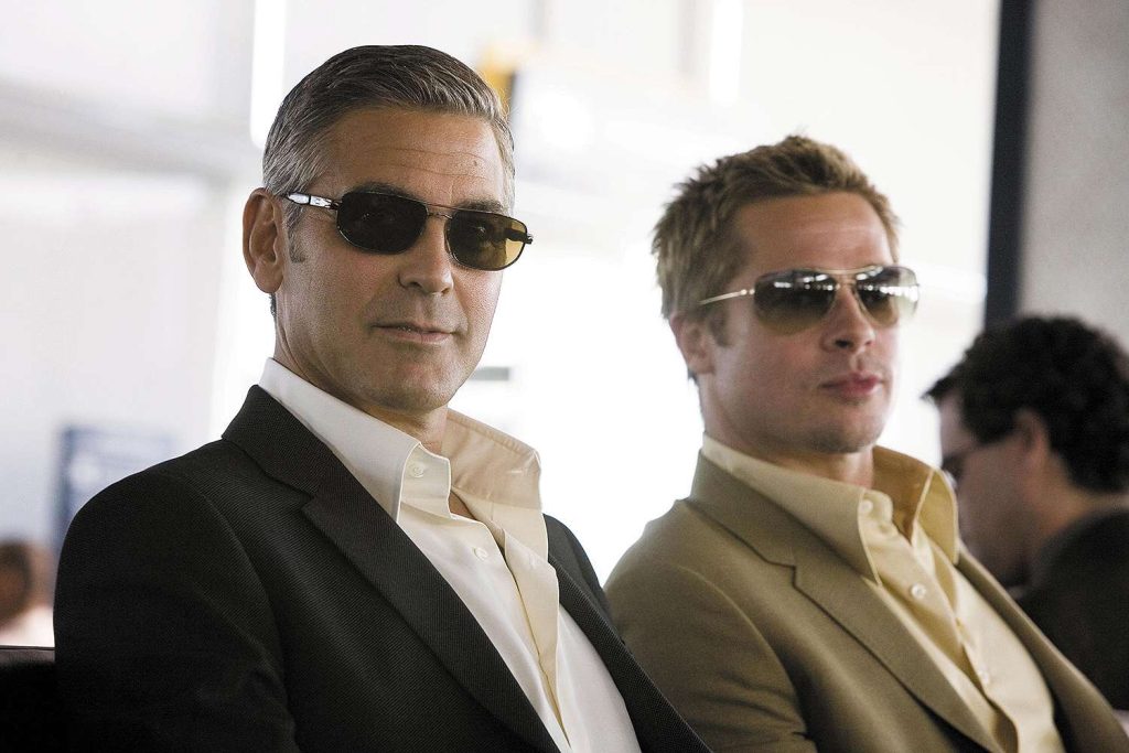 Brad Pitt and George Clooney in Ocean's Eleven | Credits: Warner Bros