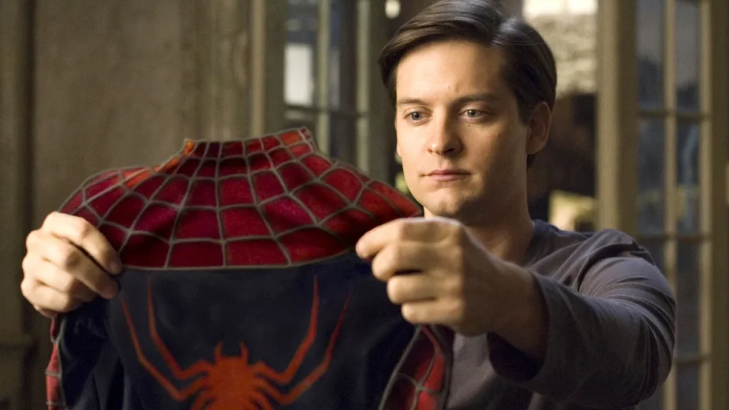 Tobey Maguire as and in Spider-Man. 