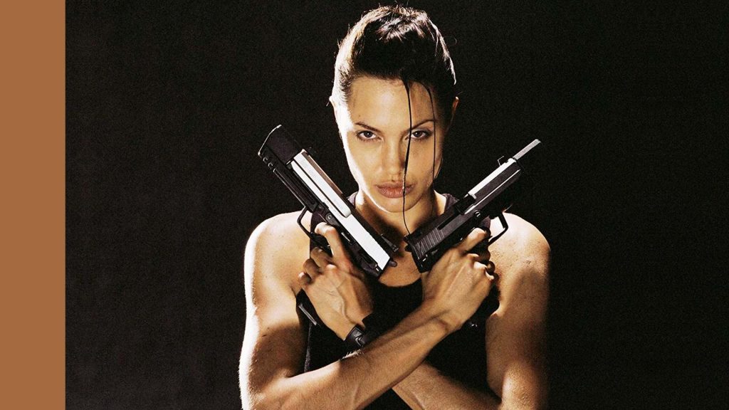 An image of Angelina Jolie in the 2001 movie, Lara Croft: Tomb Raider, striking the iconic pose of the titular character from the video games.