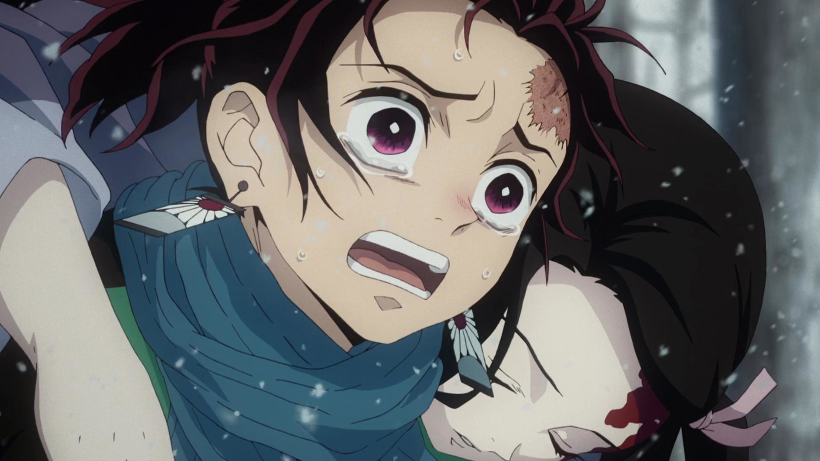 Tanjiro has tears in his eyes with an unconscious Nezuko behind his back in Demon Slayer 