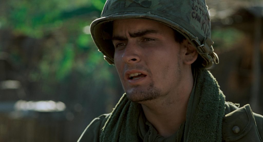 Charlie Sheen in a military attire in a still from Platoon