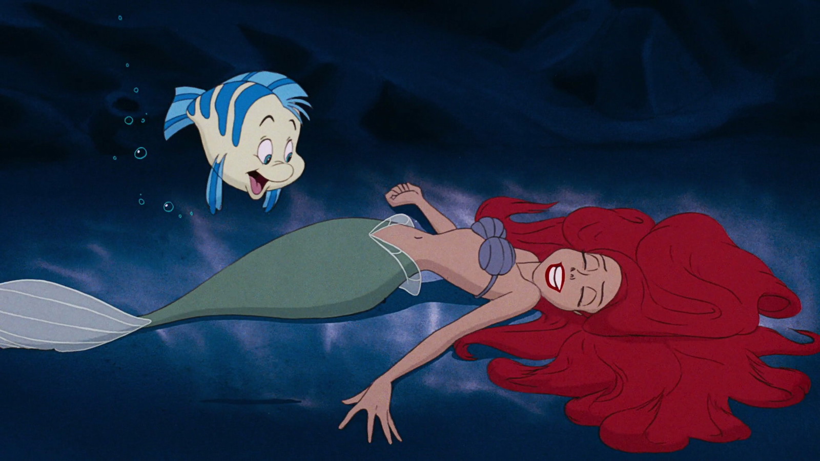 A still featuring Flounder and Ariel from The Little Mermaid (1989). 