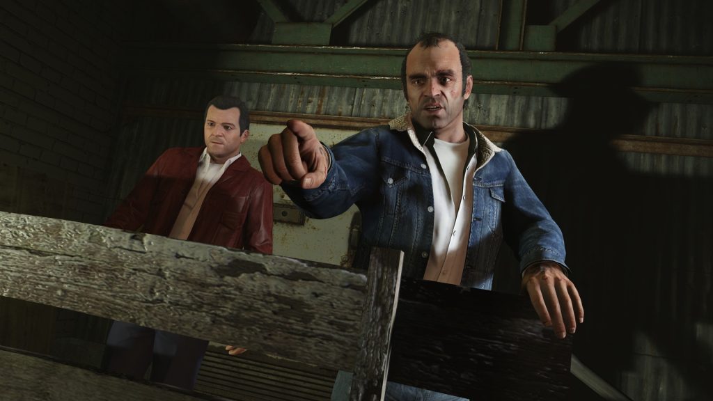 GTA 5's Trevor pointing a finger and Michael standing near him. 