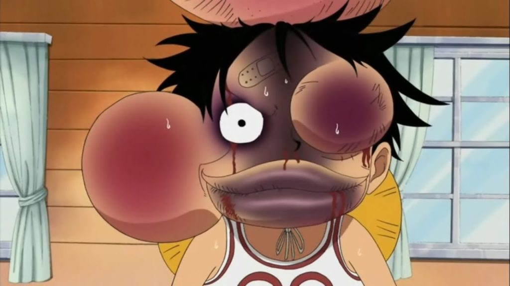 Luffy getting beaten up by his crewmates in One Piece