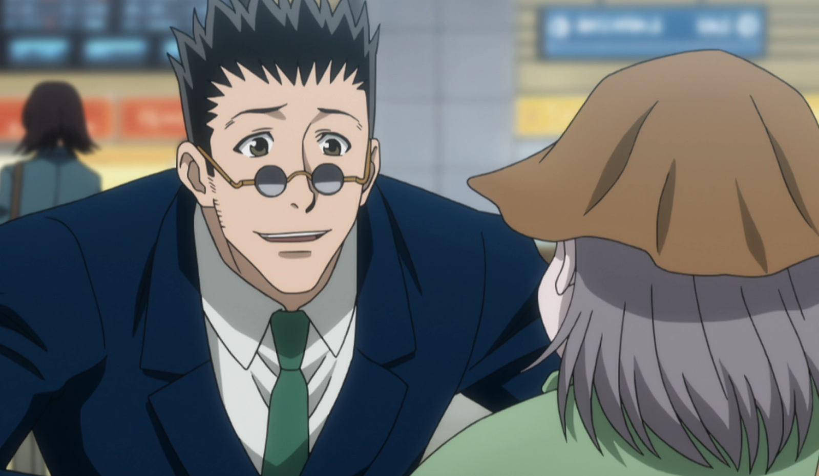 Leorio looks at Melody who is standing in front of him in Hunter x Hunter