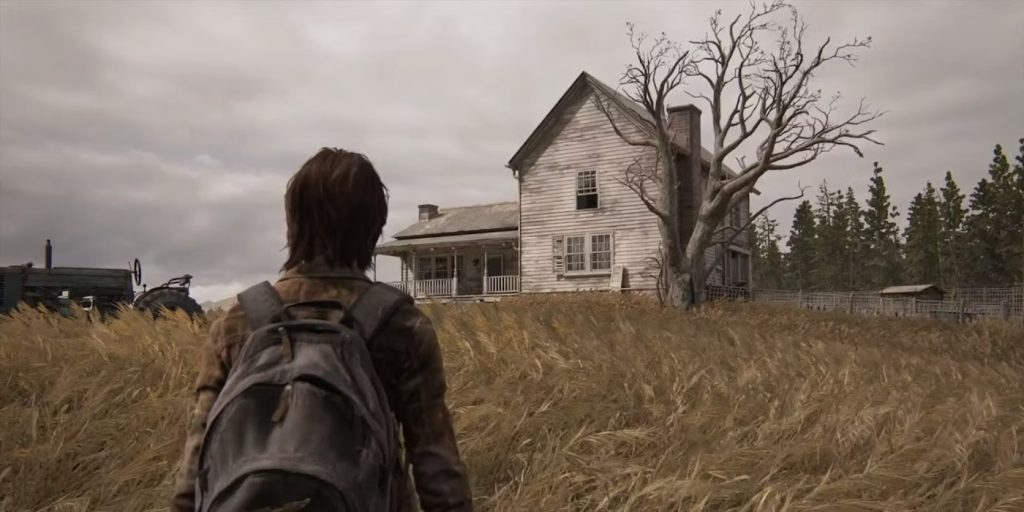 Ellie is seen walking through a field with the house in sight.