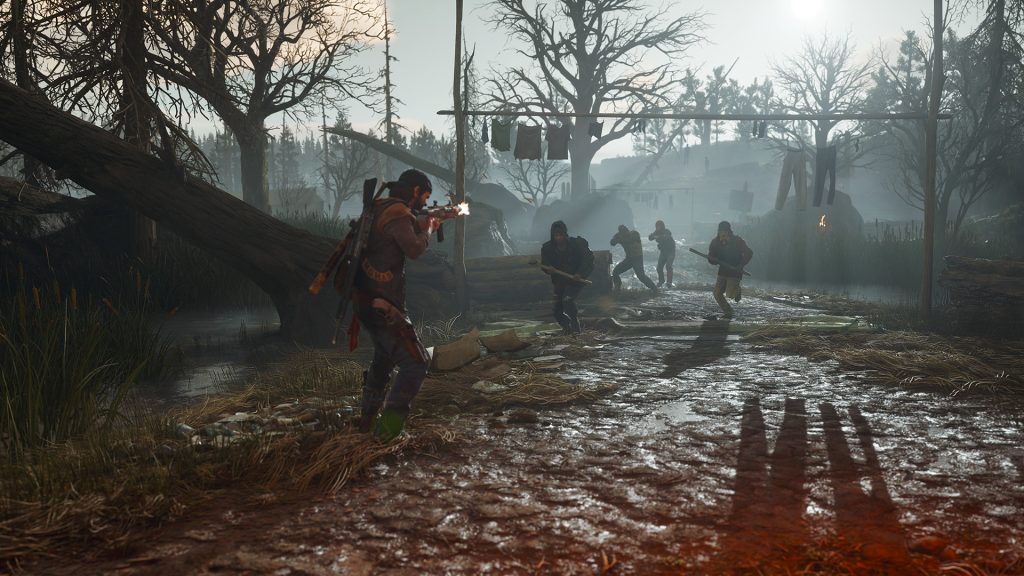 A still from Days Gone, featuring Deacon fighting a gang of Marauders.