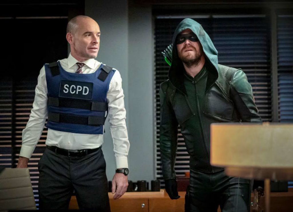 Paul Blackthorne and Stephen Amell (Green Arrow) in Arrow