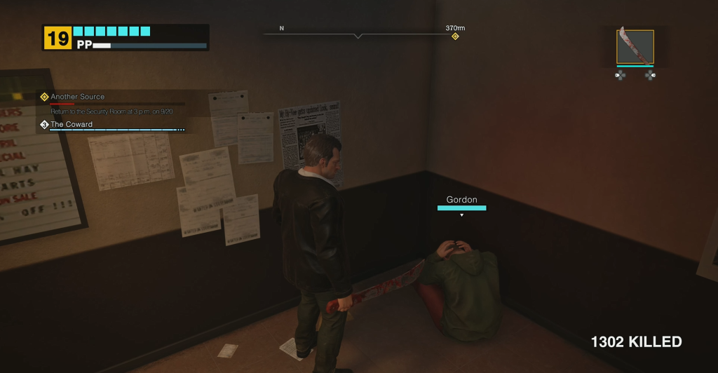 Survivor Gordon sitting in the corner with hands on his head in Dead Rising Deluxe Remaster.