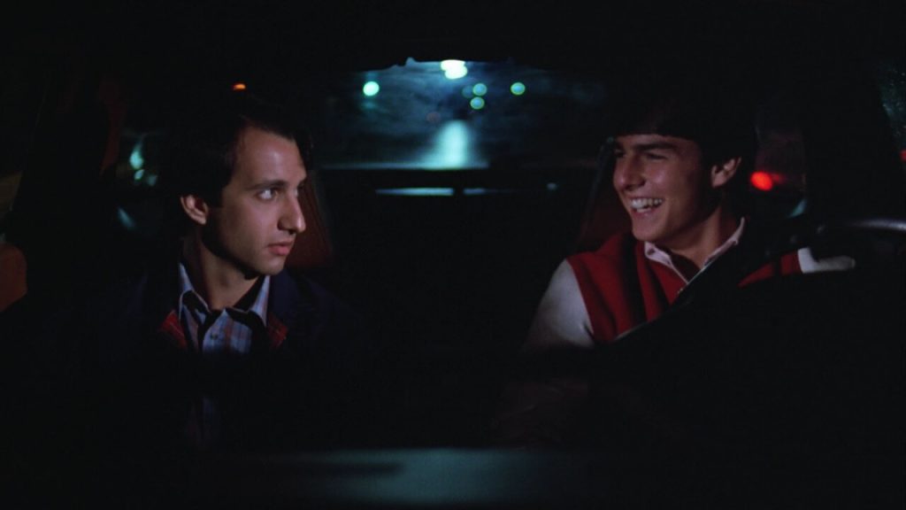 Bronson Pinchot and Cruise in a still from the movie. | Credits: Warner Bros.