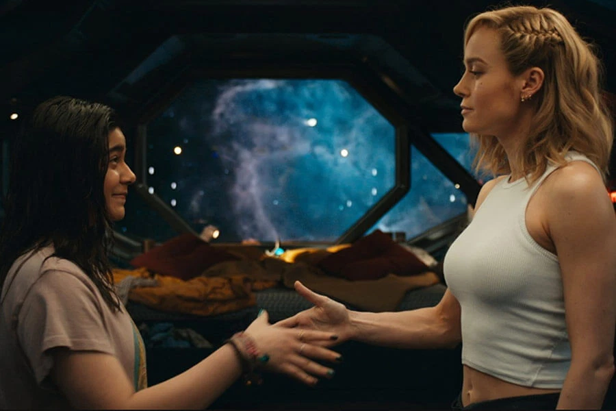 Ms. Marvel and Captain Marvel shaking hands in The Marvels 