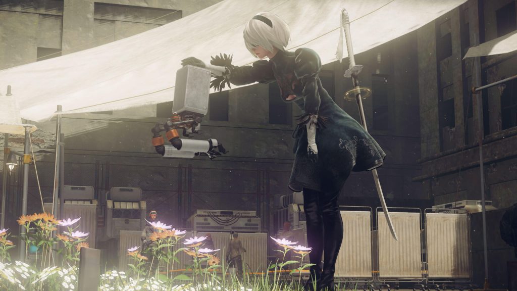 the image shows 2B petting her robot pet in Nier: Automata 