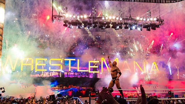 The Rock at Wrestlemania XXVIII [Photo by Ed Webster, licensed under CC BY 2.0 via Wikimedia Commons]