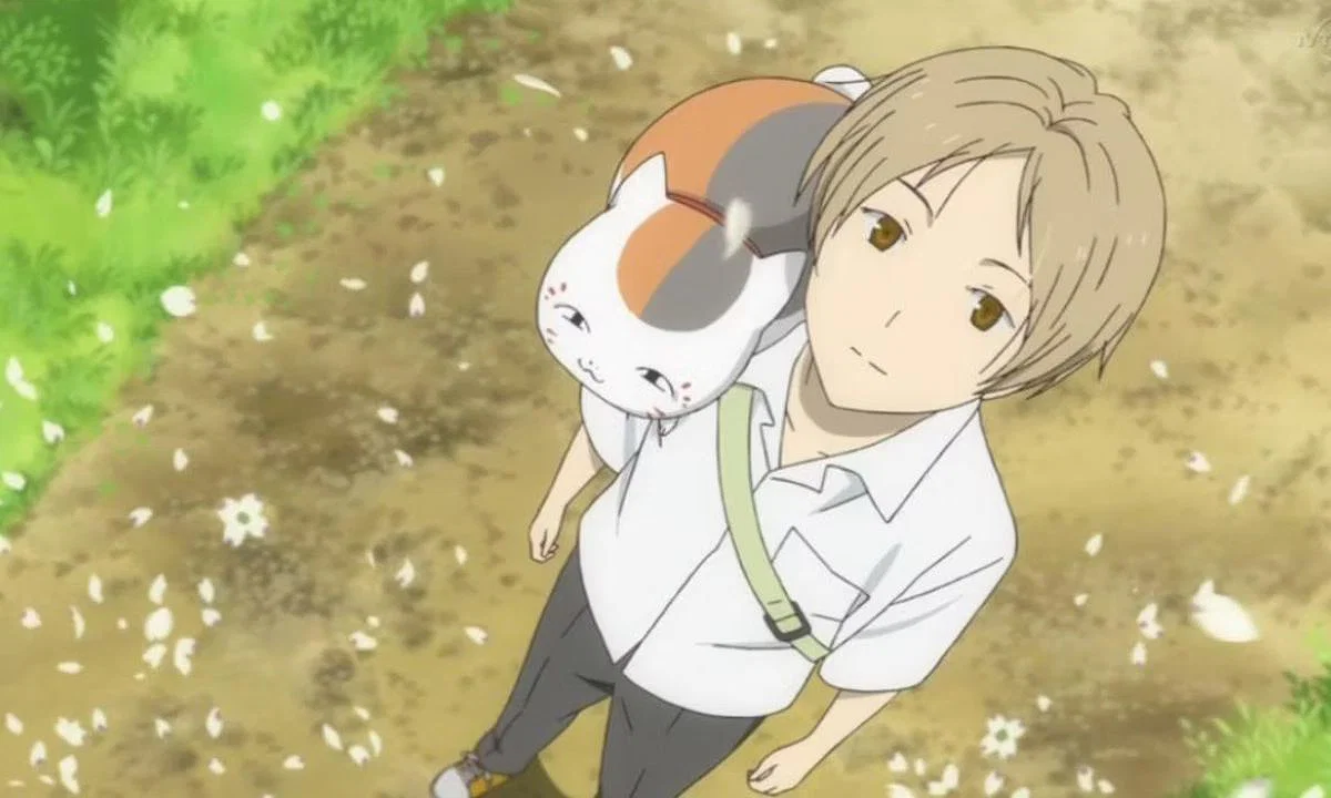 Japan Picks Detective Conan Over Spy x Family 17 Takashi Natsume and Madara (Nyanko-sensei) from the anime series Natsume's Book of Friends.