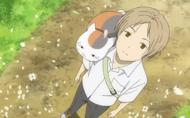 Japan Picks Detective Conan Over Spy x Family 11 Takashi Natsume and Madara (Nyanko-sensei) from the anime series Natsume's Book of Friends.