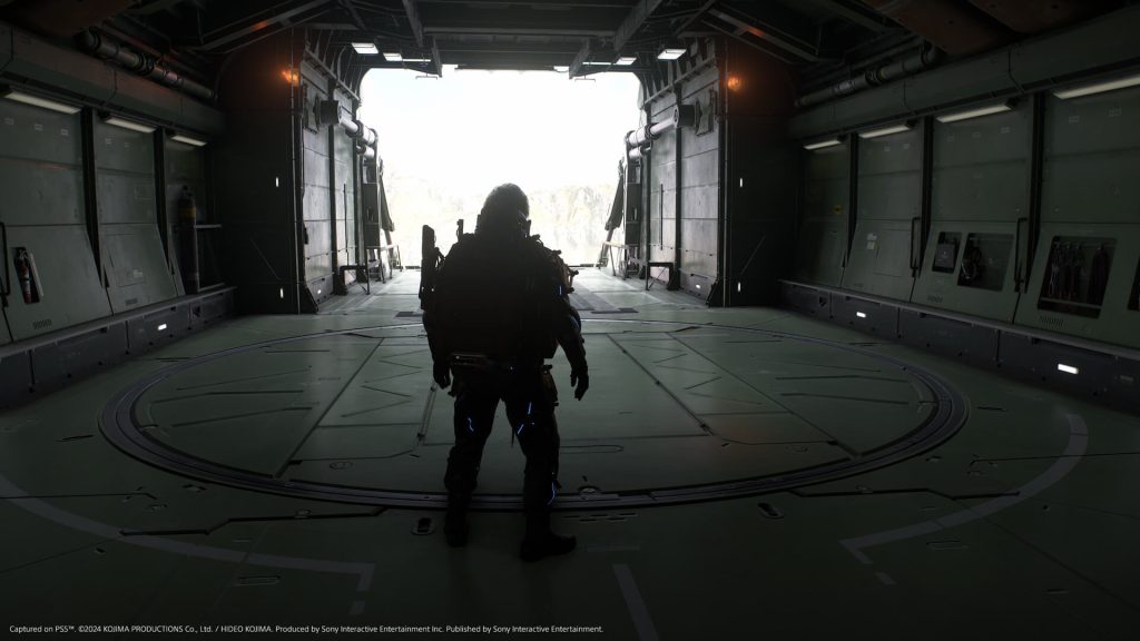 The image shows the player standing in  what looks like a exit to the space ship in Death Stranding 2 