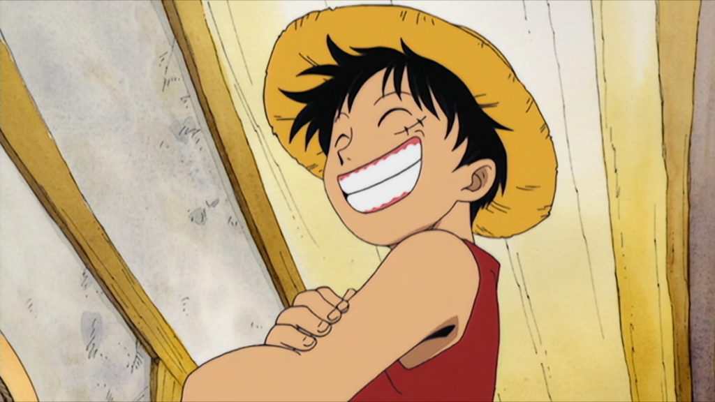 Luffy has a wide smile on his face in Eiichiro Oda's One Piece