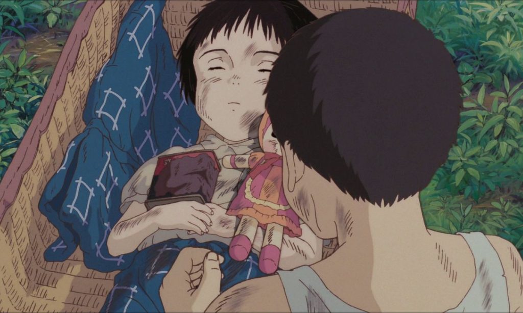 Seita cremating Setsuko in Grave of the Fireflies