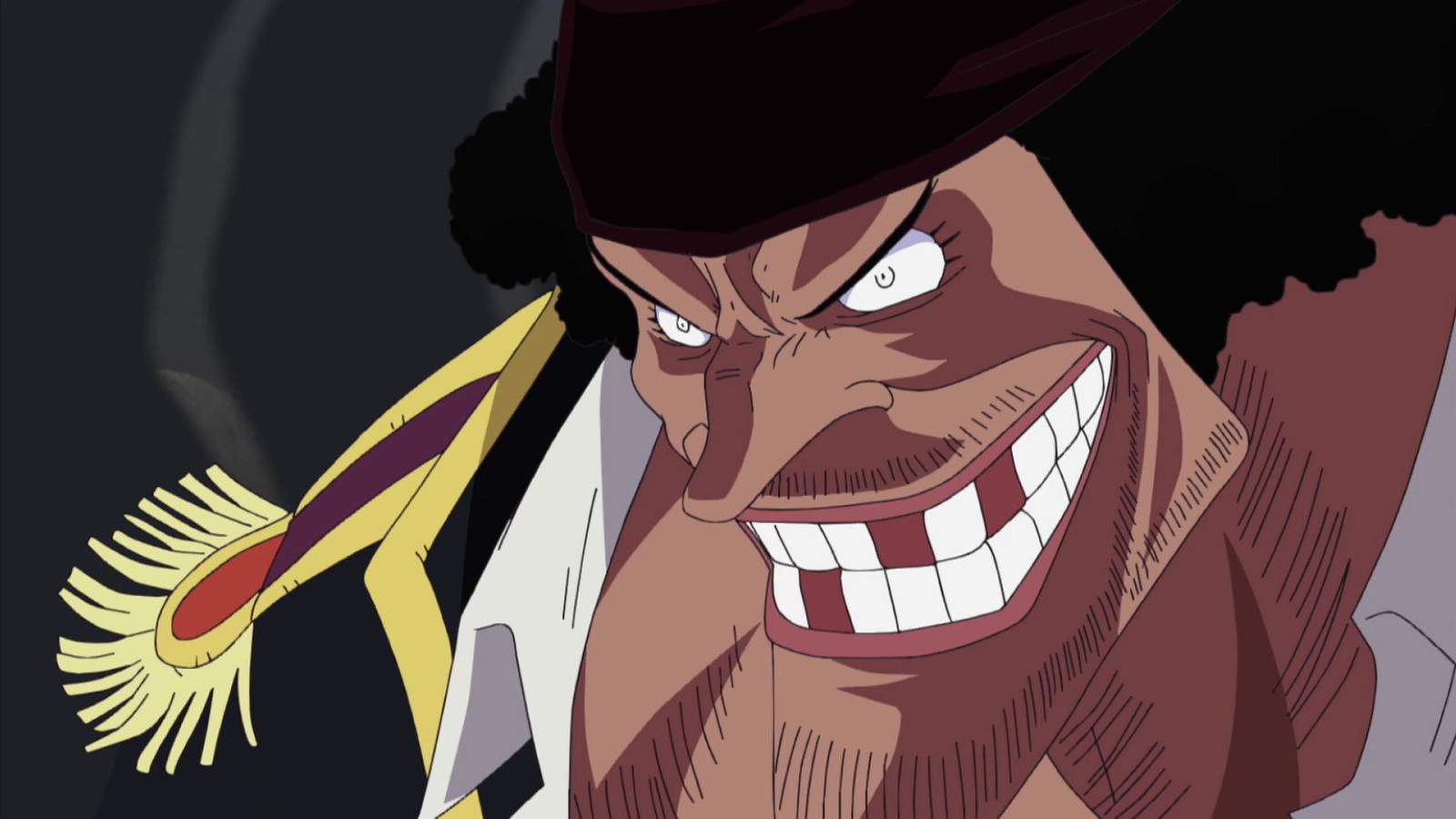 Blackbeard is looking downwards with a sinister smile in One Piece anime