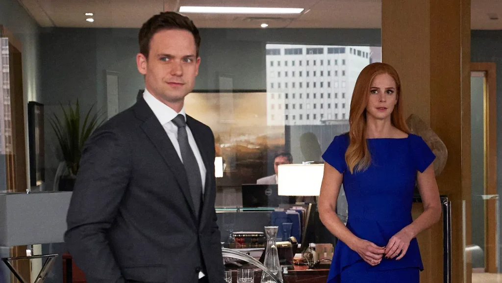 Patrick J. Adams and Sarah Rafferty in Suits. 