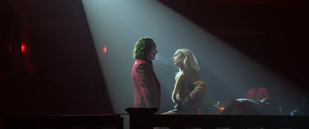 Joaquin Phoenix and Lady Gaga from a scene in this jukebox musical | Credits: Warner Bros.