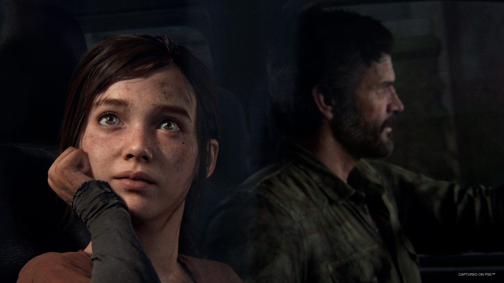 An in-game screenshot of The Last of Us shwoing Joel and Ellie.