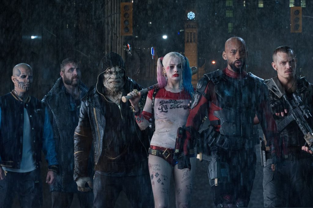 Margot Robbie as Harley Quinn with Will Smith’s Deadshot and other Suicide Squad characters 