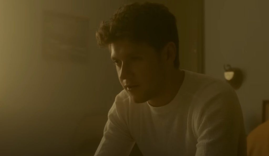 A still from Too Much To Ask music video