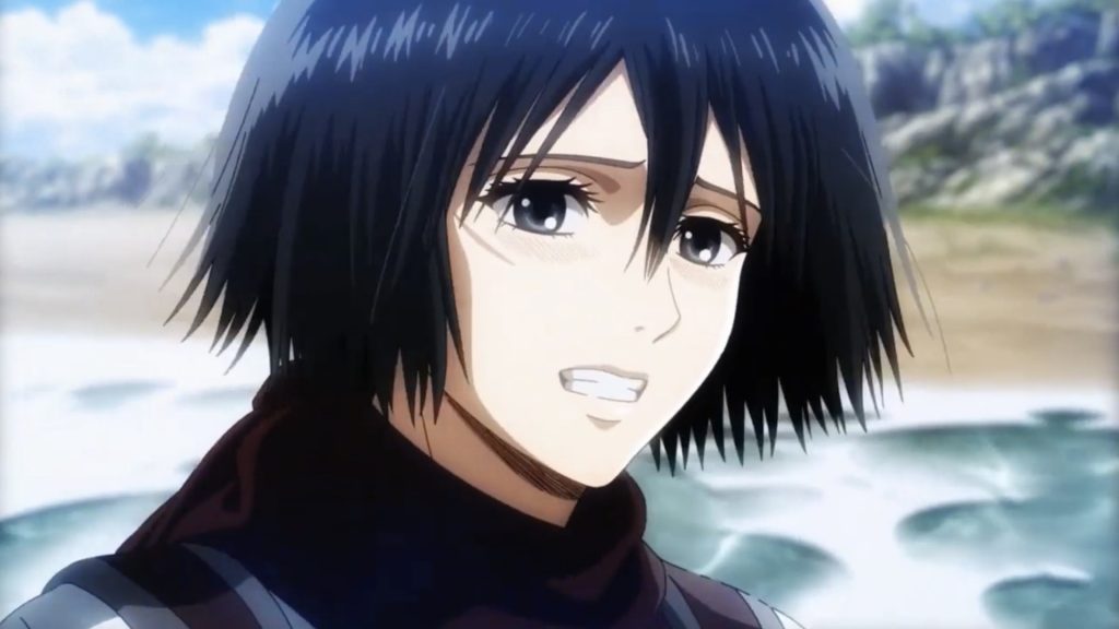 a still shot of Mikasa Ackerman who seems to be in angst from Attack on Titan anime