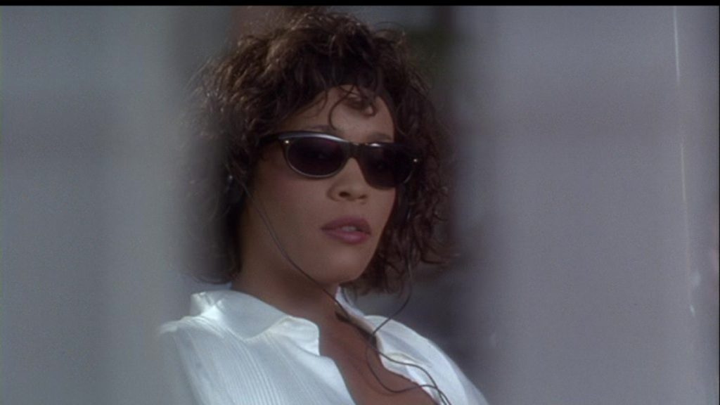 Whitney Houston in a still from The Bodyguard | Credits: Warner Bros.