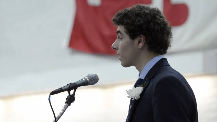 Luigi Mangione during his valedictorian speech at Gilman School | image: X/@ CollinRugg