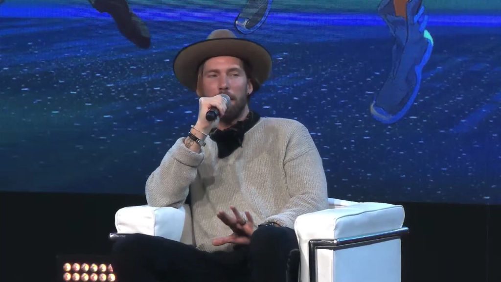 the image shows troy baker giving an interview at Milan Games Week & Cartoomics 2022