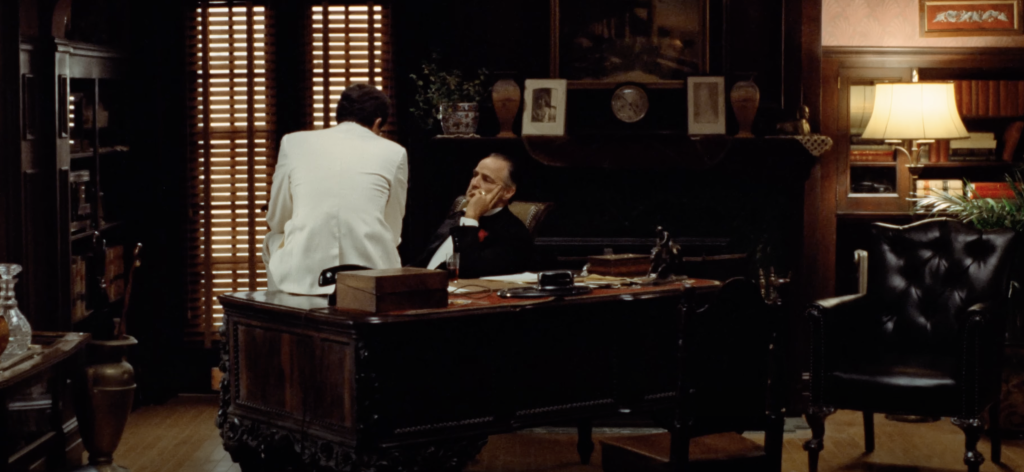 Marlon Brando as Don Vito, sitting in his study. 