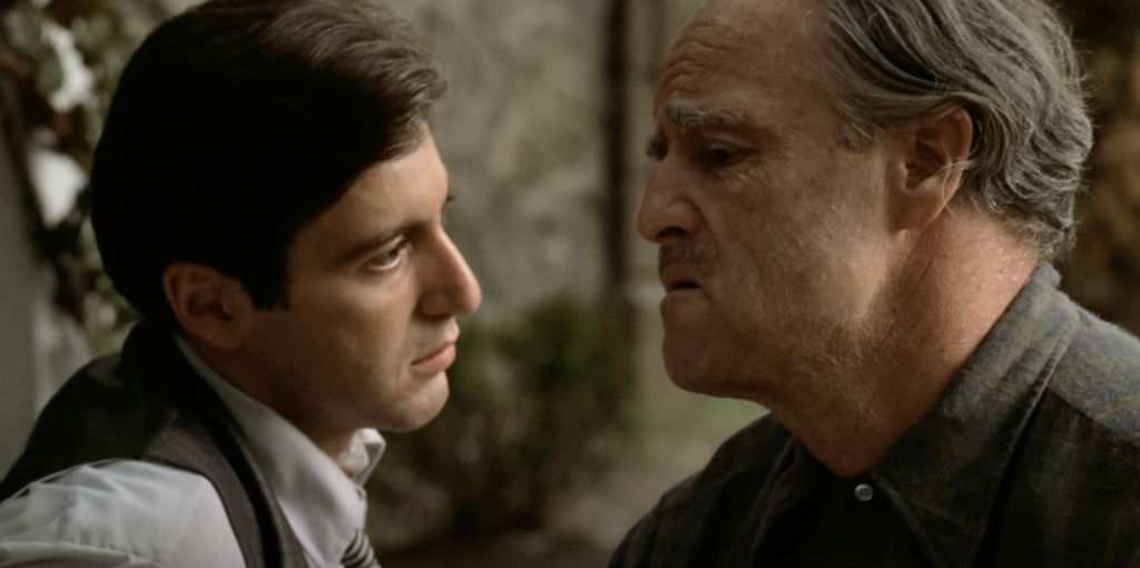 Al Pacino and Marlon Brando talking as Michael and Vito in The Godfather. 