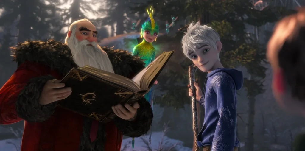 A scene from 'Rise of the Guardians' showing North (Santa Claus) holding a large ornate book, while the Tooth Fairy hovers behind him and some of her tiny fairy helpers flying nearby. Jack Frost stands to the right, holding his wooden staff.