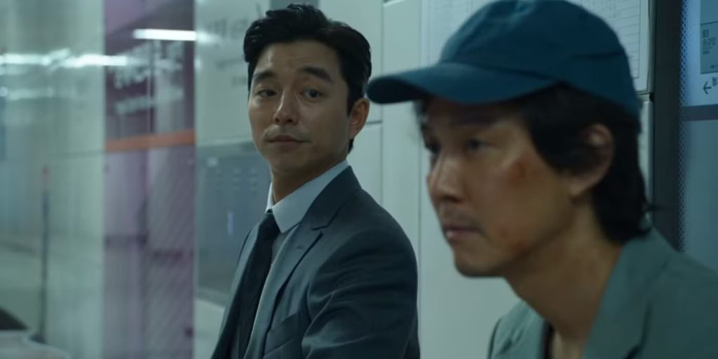Squid Game’s Hwang Dong-Hyuk Has a Twisted Master Plan And It’s Only the Beginning 2 A still from Squid Game featuring Gong Yoo and Lee Jung-jae