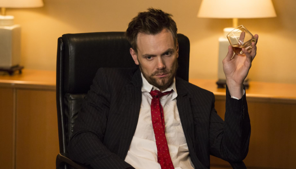 Joel McHale as Jeff Winger in a serious moment from the Community TV show.