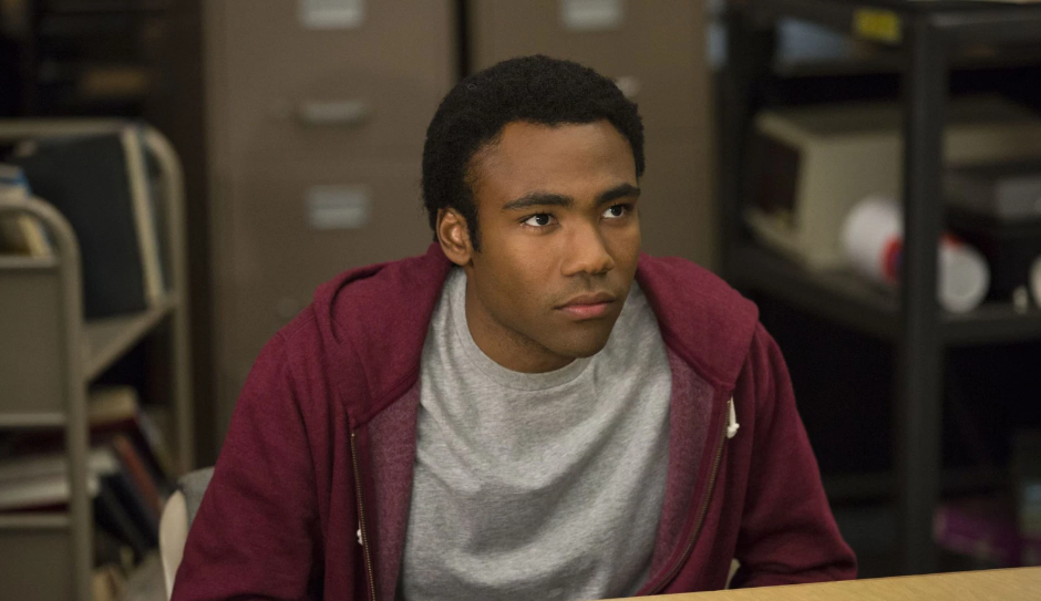 Donald Glover as Troy Barnes in Community show, smiling and showing his signature goofy charm.