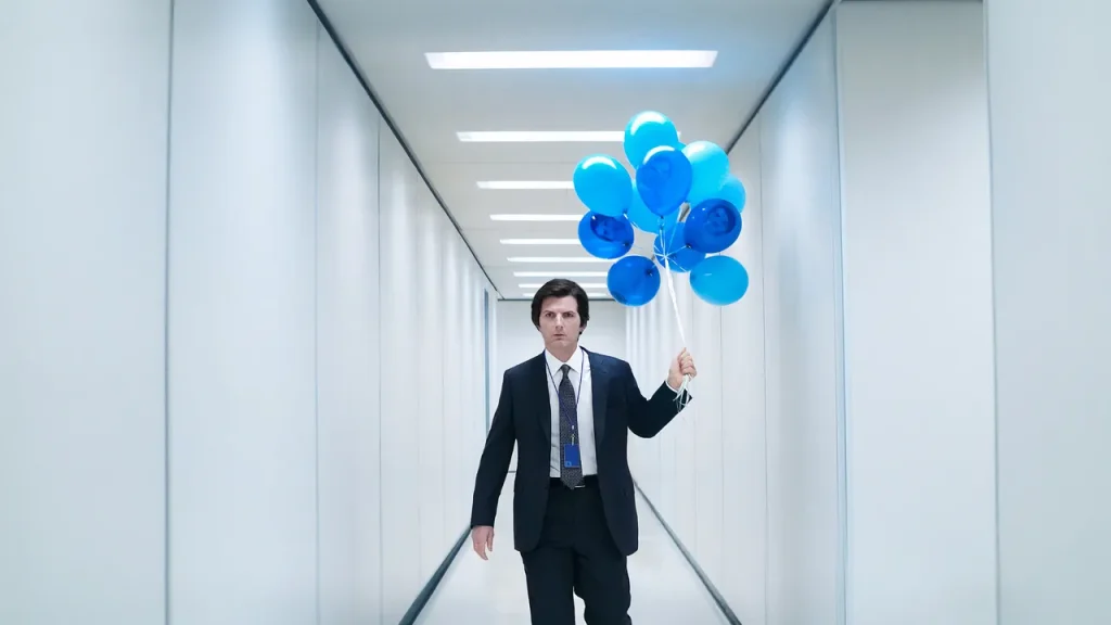 Adam Scott holding blue balloons in a still from Severance Season 2