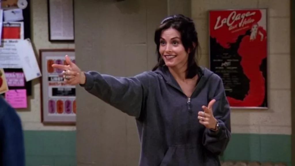 Monica (Courteney Cox) finishing the tap dance session by pointing outwards in the FRIENDS episode titled "The One with the Fake Monica" (Season 1, Episode 21)